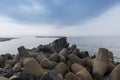 Helgoland, Dune Island, stone windbreak in the sea with beautiful dramatic sky.