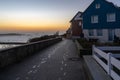 Helgoland, Germany - 02.27.2022: Frozen footprints on a concrete pathway by the sea in German island of Helgoland in the