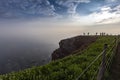 Helgoland, Long Anna, landscape with steep hillside and red rock with nests of gannets, at sunrise, shrouded in morning mist with