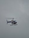 Helicopter against grey clouds shot in Cairns, Australia