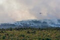 Helicopter against wildfire during strong wind and drought