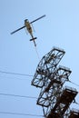 Helicopter Airlifting Workmen from Power Line Royalty Free Stock Photo