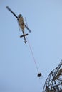 Helicopter Airlifting Workmen from Power Line Royalty Free Stock Photo