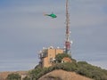 Helicopter approaching communications tower of Sant Jeroni Royalty Free Stock Photo