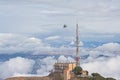 Helicopter approaching communications tower of Sant Jeroni Royalty Free Stock Photo