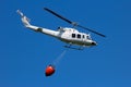 Helicopter with a Bambi bucket Royalty Free Stock Photo