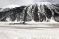 A helicopter in the beautiful scenics of snow covered landscape and mountains in the alps switzerland Royalty Free Stock Photo