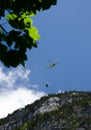 helicopter carrying a small cargo load above mounts in Lauterbrunnen valley