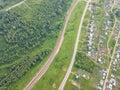 Helicopter drone shot village with road