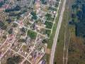 Helicopter drone shot village with road