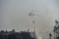 Helicopter drops water on forest fire Royalty Free Stock Photo