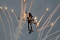 Helicopter of the Dutch Air Force firering off light flares while performing a looping during airshow display..15/09/2013 -