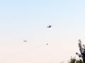 Helicopter extinguishes forest fires, closeup. Provence, near Avignon, July 14, 2022 Royalty Free Stock Photo