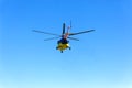 A helicopter flies off in the sky Royalty Free Stock Photo