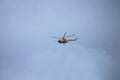 Helicopter Flight yellow windship of the Russian oil company ROSNEFT in the blue sky Russia SOCHI 12.04.21