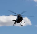 Helicopter soaring in the blue sky. Royalty Free Stock Photo