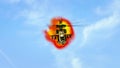 Helicopter flying in front of explosion Royalty Free Stock Photo