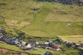 Helicopter flying over mykines village in Faroe. Denmark