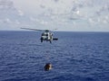 US Navy Helicopter Flying Over the Ocean.