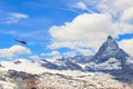 Helicopter flying over snowy Matterhorn peak, Switzerland Royalty Free Stock Photo