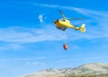 Helicopter,forest fire,water,rescue,uncontrolled fire,extinguish,firefighters,fire,civil protection,forestry,forest ranger,militar Royalty Free Stock Photo