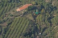 Helicopter with freight flying over a green landscape