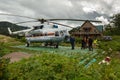 Helicopter landed on the ground near reserve administration in Valley of Geysers. Kronotsky Nature Reserve on Kamchatka