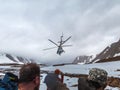 The helicopter landed tourists in the mountains