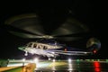 Helicopter landing in offshore oil and gas platform on deck or parking area. Helicopter night flight training of pilot