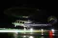 Helicopter landing in offshore oil and gas platform on deck or parking area. Helicopter night flight training of pilot