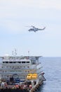 Helicopter landing on offshore oil rig, Passenger transfer to offshore oil and gas platform for work. Royalty Free Stock Photo