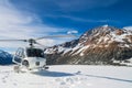 Helicopter landing on a snow mountain Royalty Free Stock Photo