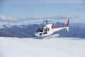 Helicopter Landing On Snowy Mountain Top Royalty Free Stock Photo