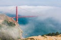 Helicopter in the mist of the GoldenGate Bridge Royalty Free Stock Photo