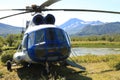 Helicopter with mountains behind it Royalty Free Stock Photo