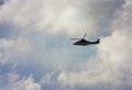 Helicopter on the outskirts of Burnley in a shadow of Pendle Hill in Lancashire