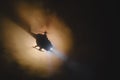 Helicopter over fire sunset horizon. War concept. Military scene of flying helicopter fire backgroung effect. Decoration