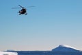 Helicopter over icebergs Royalty Free Stock Photo