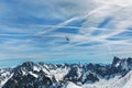 Helicopter over mountain peaks