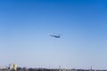 Helicopter over the river in cold, sunny weather.