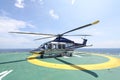 Helicopter parking landing on offshore platform. Helicopter transfer crews or passenger to work in offshore oil and gas industry Royalty Free Stock Photo