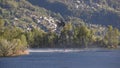 Helicopter picking up water during fire fighting operations