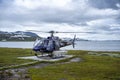 Helicopter Pilot and Crew on the helipad waiting on Passengers