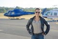 Helicopter pilot posing on tarmac