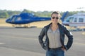 Helicopter pilot posing on tarmac Royalty Free Stock Photo