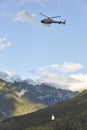 Helicopter rescue training simulation in a mountain range wood. Firefighter