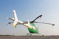Helicopter standing on landing strip in airfield. Low angle view Royalty Free Stock Photo