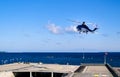 Helicopter starting from helipad By Tallinn - Baltic sea