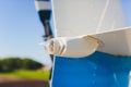 Helicopter tail rotor selective focus or Tail rotor of transport helicopter under hangar background. Royalty Free Stock Photo