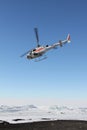 Helicopter taking off in Antarctica